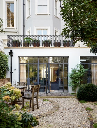 Small garden design ideas. Image may contain Walkway Path Furniture Chair and French Door