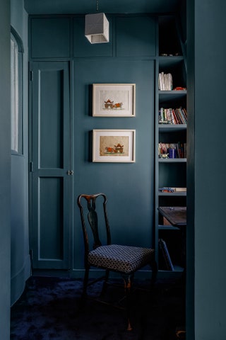 The wardrobe nook is also used as a study. In it hang artworks found on a trip to Japan. An internal window on the right...