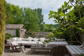 Image may contain Outdoors Furniture Nature Couch Table Patio Living Room Room and Indoors