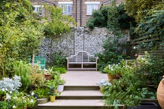 Small garden ideas. Image may contain Garden Outdoors Arbour Vase Plant Pottery Potted Plant Jar Planter Human and Person