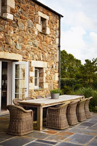 Image may contain Patio Furniture and Table