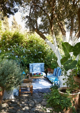 Image may contain Yard Outdoors Nature Patio Furniture Chair Couch and Flagstone