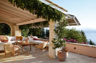 The same house features a mixture of seating from Kettal  aluminiumframed ‘Vieques sofas and classic ‘Basket chairs...
