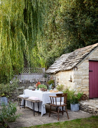 Image may contain Outdoors Furniture Chair Nature Housing Building Tree Plant House and Countryside