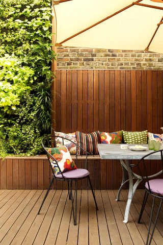 Image may contain Furniture Chair Dining Table Table Cushion Pillow Porch Outdoors Yard and Nature